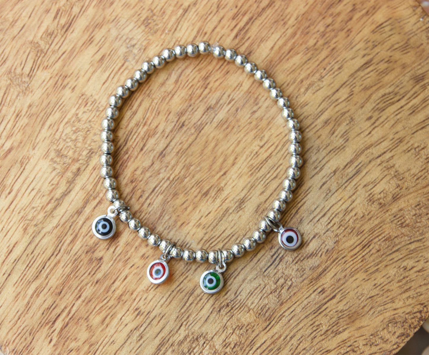 bracelet en acier inoxydable et pendentifs oeil