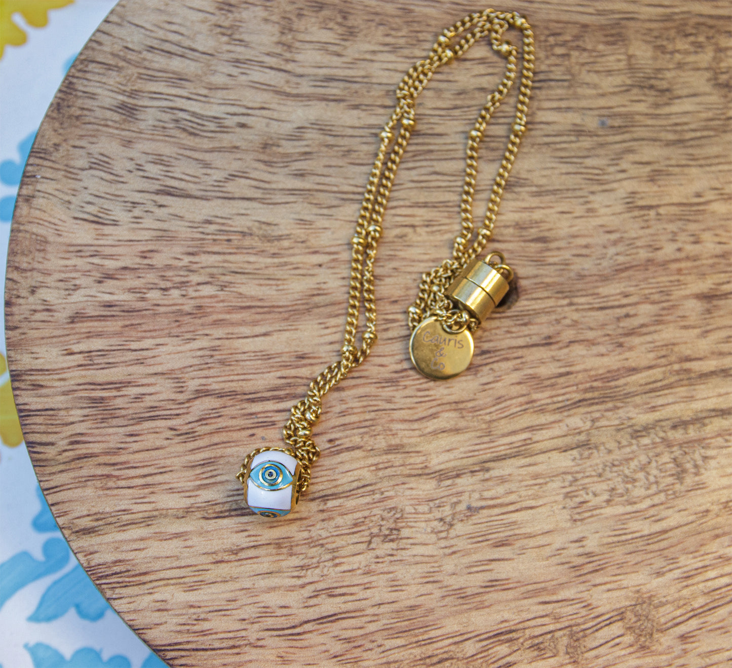Collier femme en acier inoxydable doré et pendentif oeil emaillé blanc et turquoise - caurisandco