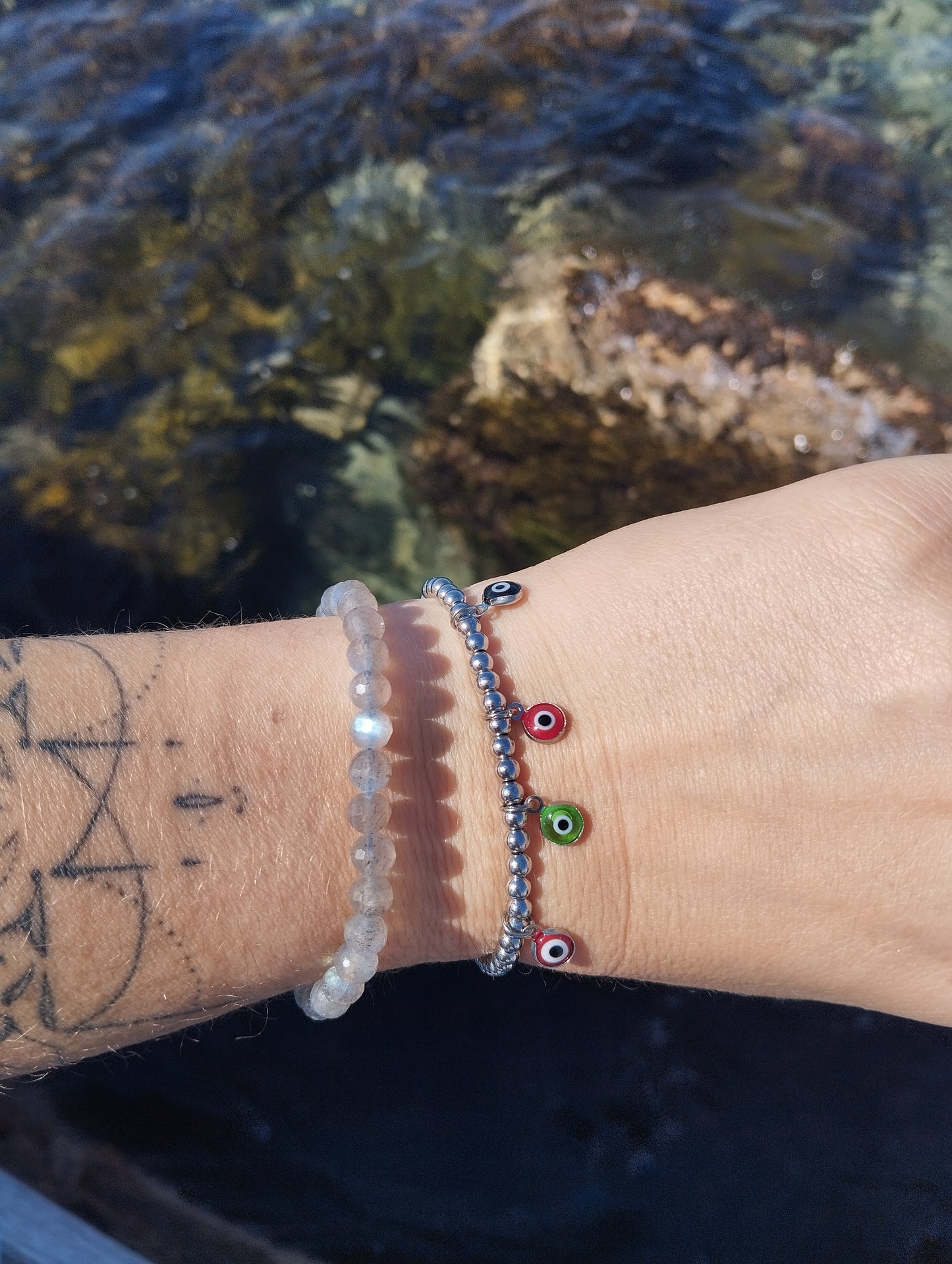bracelet en acier inoxydable et pendentifs oeil