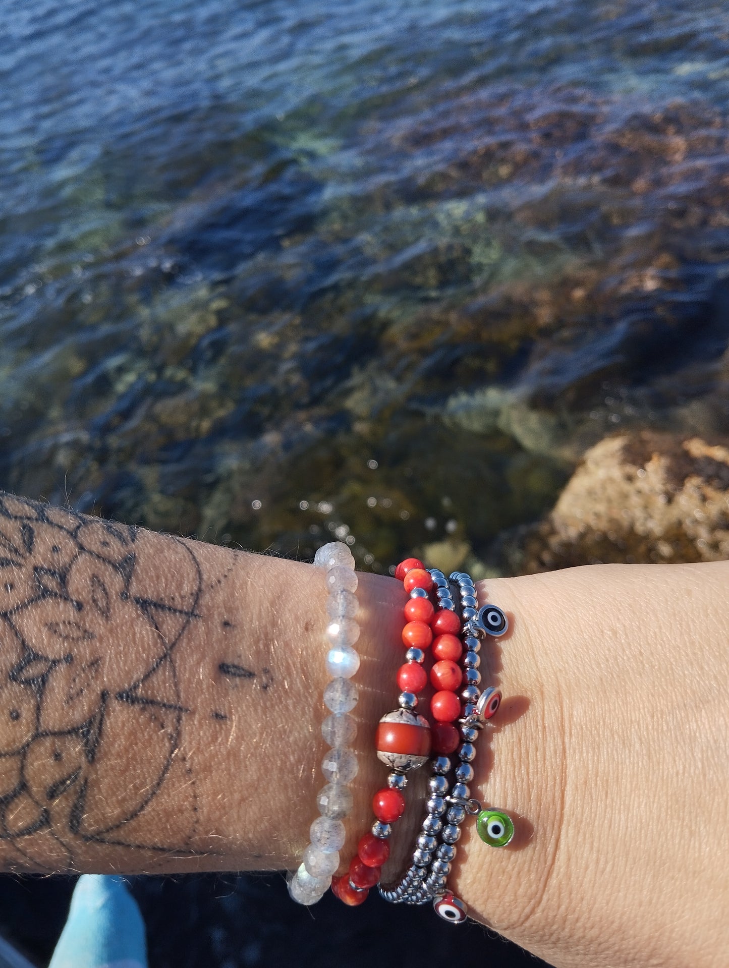 bracelet en acier inoxydable et pendentifs oeil