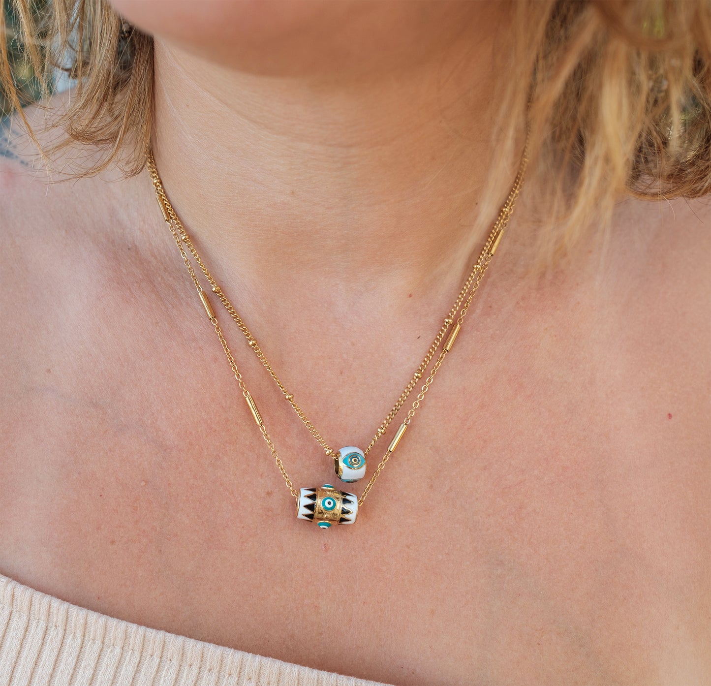 Collier femme en acier inoxydable doré et pendentif oeil emaillé blanc et turquoise - caurisandco