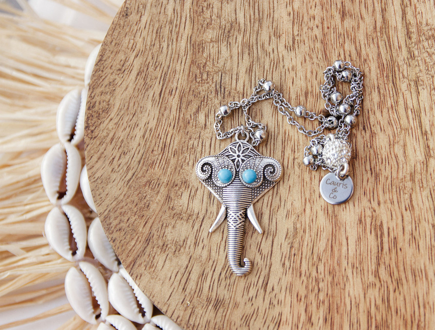 collier en acier inoxydable et pendentif elephant boheme avec oeil cabochon en turquoise caurisandco cauris and co