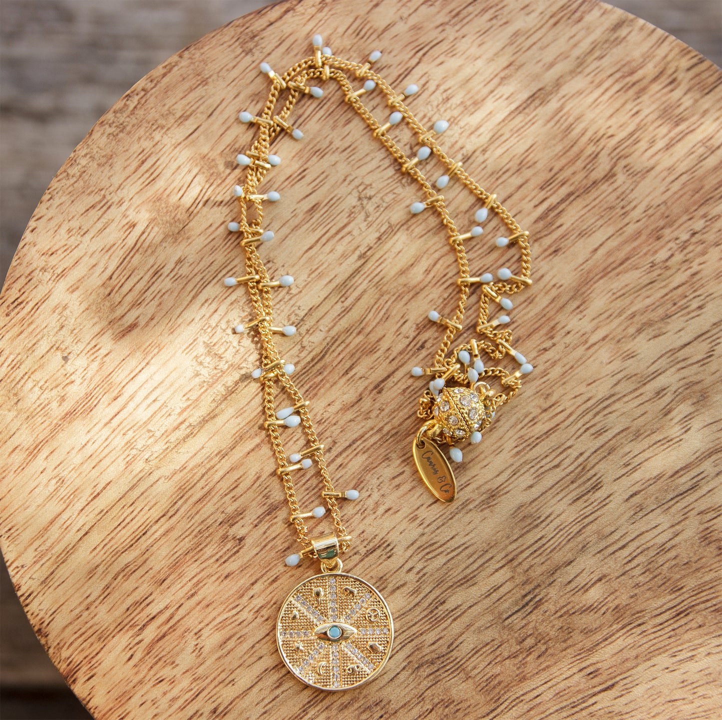 collier pendentif œil en acier inoxydable fin à sequins - caurisandco