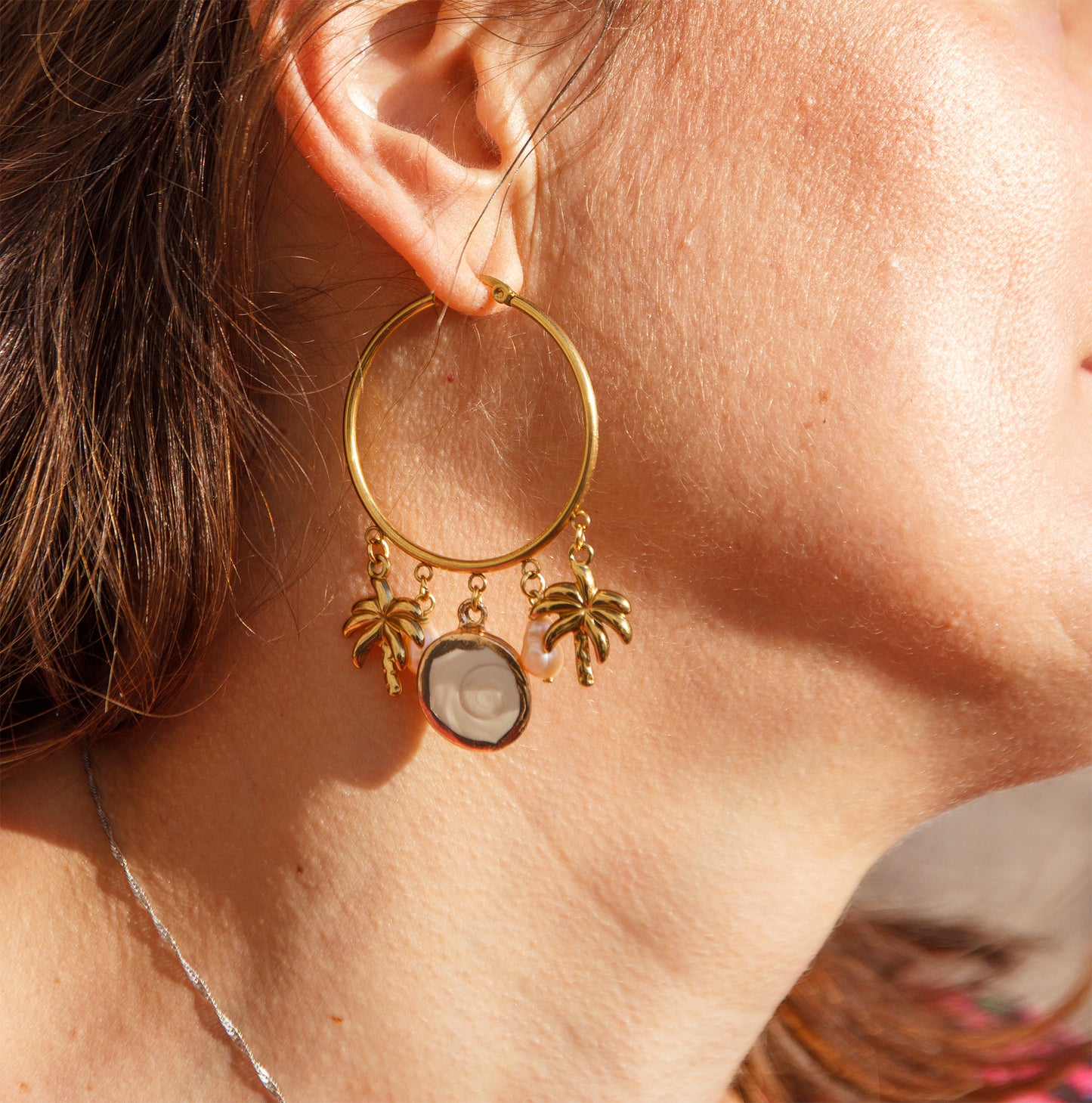 Boucle d'oreille à breloque oeil de ste lucie et palmier