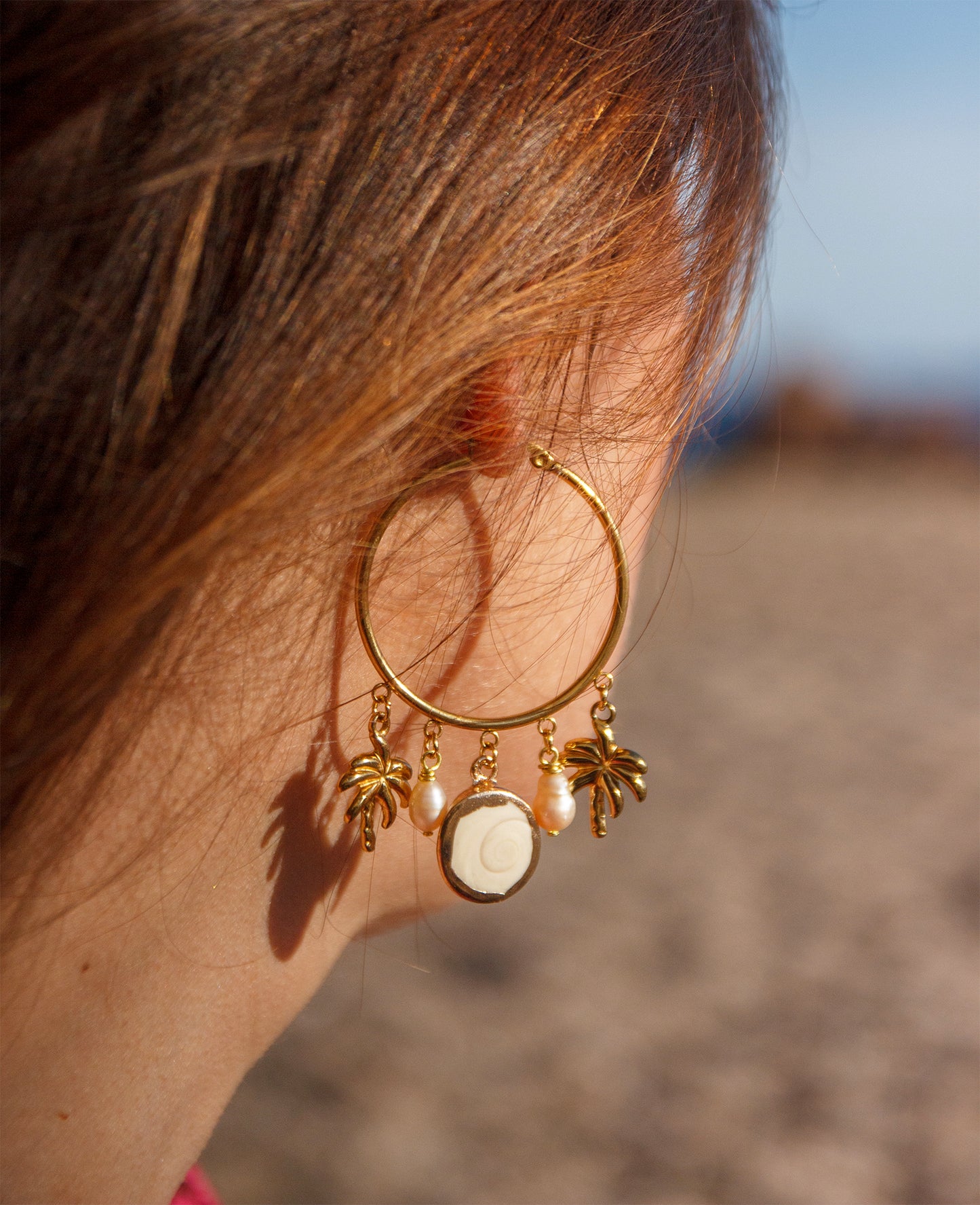 Boucle d'oreille à breloque oeil de ste lucie et palmier
