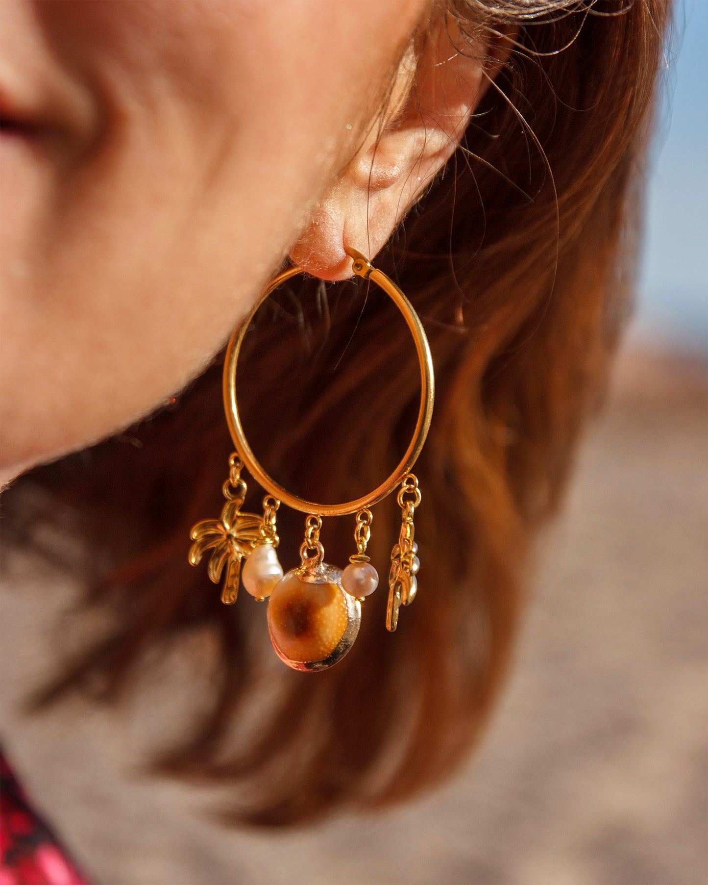 Boucle d'oreille à breloque oeil de ste lucie et palmier